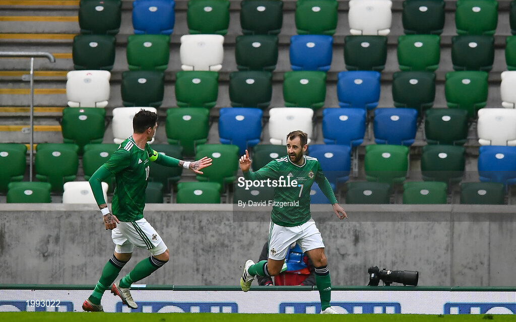 28 March 2021; Niall McGinn of Northern Ireland celebrates with teammate Kyle Lafferty, left, after scoring his side's first goal during the International friendly match between Northern Ireland and USA at the National Football Stadium at Windsor Park in Belfast. Photo by David Fitzgerald/Sportsfile