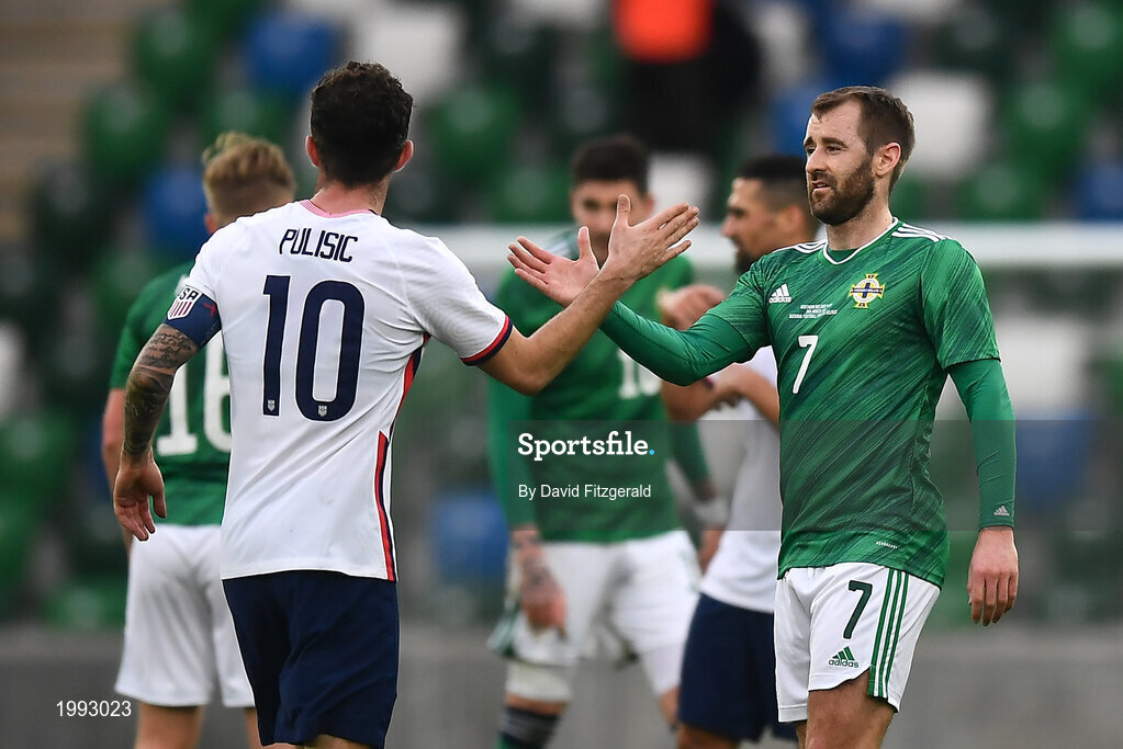 28 March 2021; Niall McGinn of Northern Ireland and Christian Pulišic of USA following the International friendly match between Northern Ireland and USA at the National Football Stadium at Windsor Park in Belfast. Photo by David Fitzgerald/Sportsfile