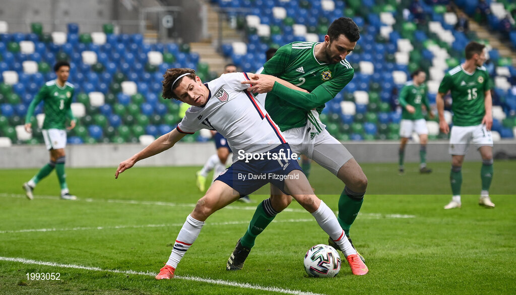 28 March 2021; Brenden Aaronson of USA in action against Conor McLaughlin of Northern Ireland during the International friendly match between Northern Ireland and USA at National Football Stadium at Windsor Park in Belfast. Photo by David Fitzgerald/Sportsfile