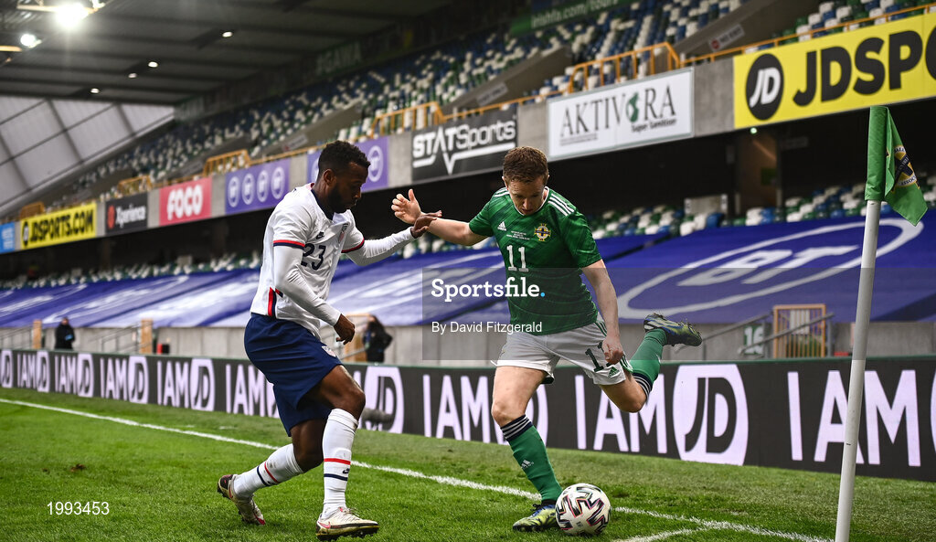 28 March 2021; Shane Ferguson of Northern Ireland in action against Kellyn Acosta of USA during the International friendly match between Northern Ireland and USA at National Football Stadium at Windsor Park in Belfast. Photo by David Fitzgerald/Sportsfile