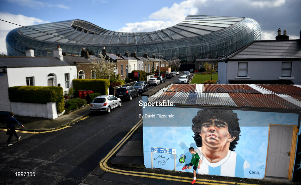 12 April 2021; Local resident Johnny Figo Murphy, age 9, from Dublin shows his skills in front of a mural by Dublin artist Chelsea Jacobs depicting the late Argentine footballer Diego Maradona at Havelock Square in Dublin. Photo by David Fitzgerald/Sportsfile