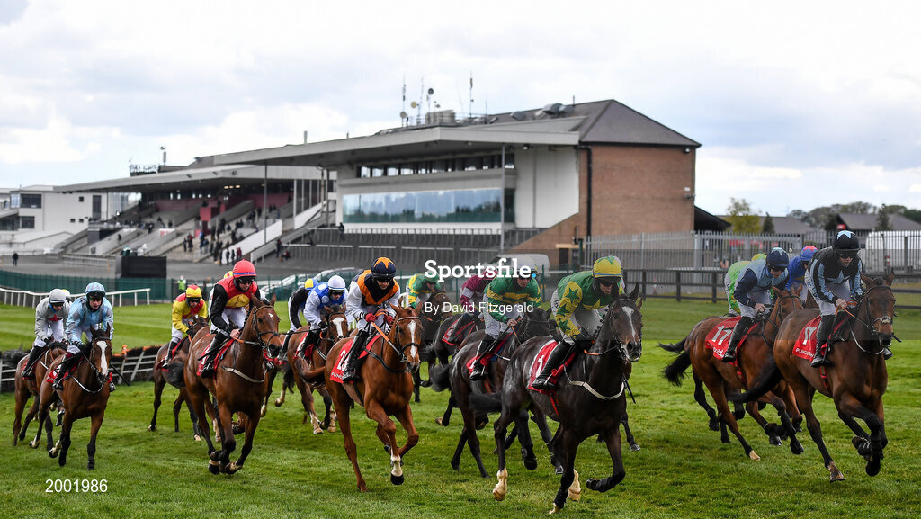 27 April 2021; Runners and riders race past the empty grandstand during the Have The Conversation Say Yes To Organ Donation Novice Handicap Hurdle during day one of the Punchestown Festival at Punchestown Racecourse in Kildare. Photo by David Fitzgerald/Sportsfile