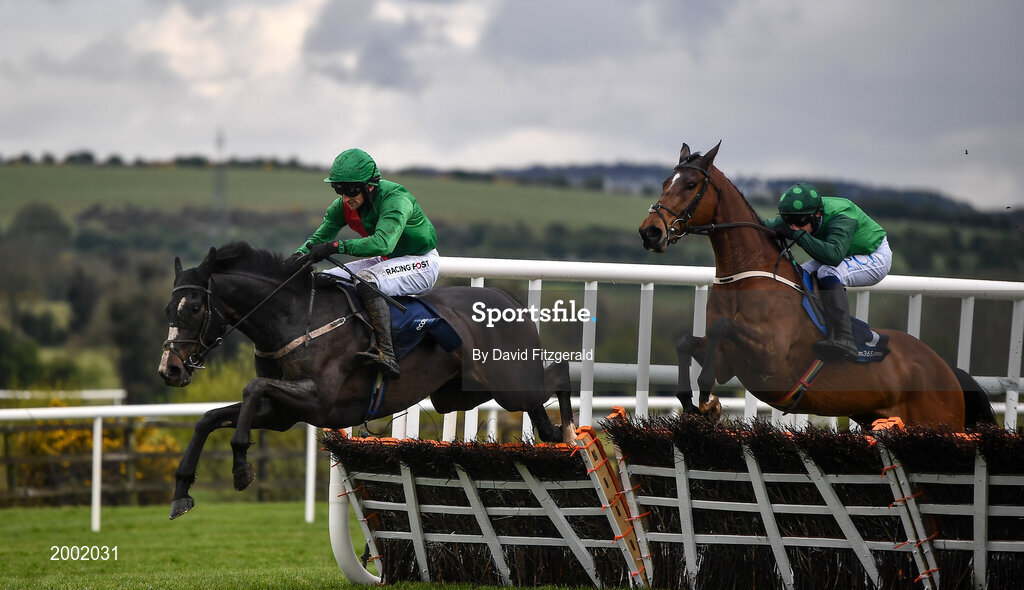 27 April 2021; Echoes in Rain, with Patrick Mullins up, clear the last ahead of eventual third Blue Lord, with Paul Townend up, on their way to winning the eCOMM Merchant Solutions Champion Novice Hurdle during day one of the Punchestown Festival at Punchestown Racecourse in Kildare. Photo by David Fitzgerald/Sportsfile