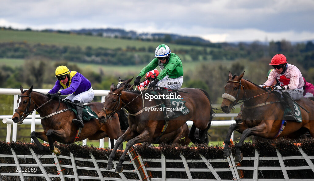 27 April 2021; Jazzaway, with Conor McNamara up, centre, jumps the last alongside eventual second place Whiskey Sour, with Hugh Morgan up, left, and Arcadian Sunrise, with Denis O'Regan, right, on their way to winning the Killashee Hotel Handicap Hurdle during day one of the Punchestown Festival at Punchestown Racecourse in Kildare. Photo by David Fitzgerald/Sportsfile