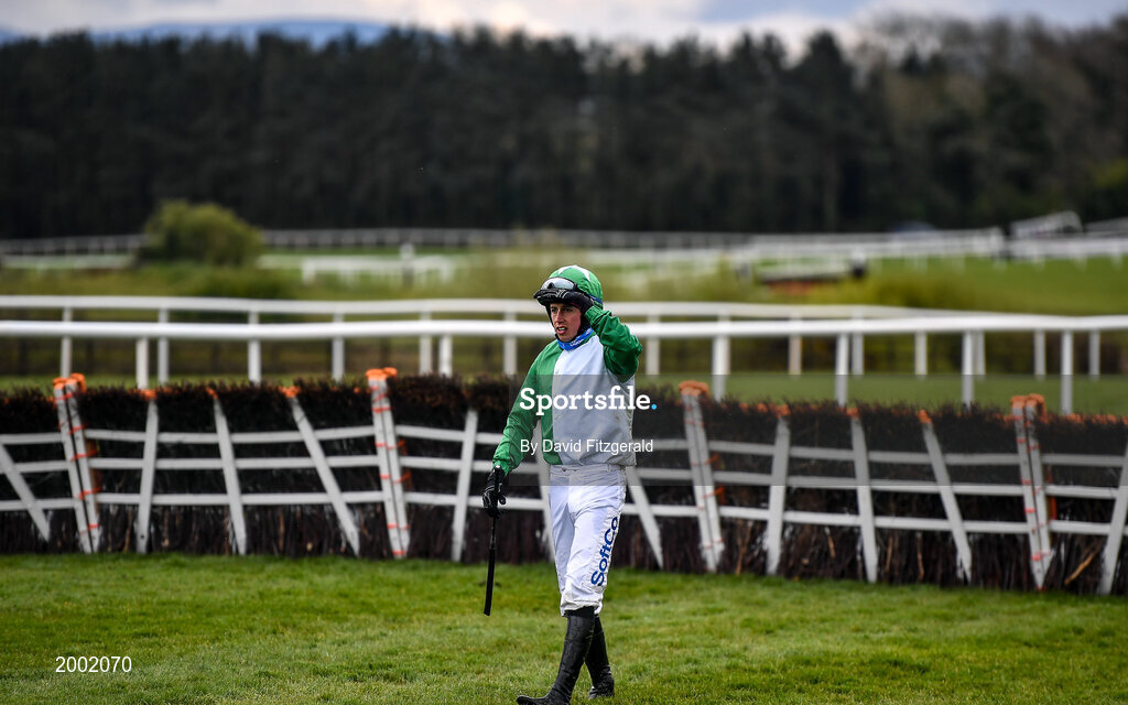 27 April 2021; Jockey Bryan Cooper walks back from the start of the race after he was unseated from his horse Getaway Gorgeous prior to the Killashee Hotel Handicap Hurdle during day one of the Punchestown Festival at Punchestown Racecourse in Kildare. Photo by David Fitzgerald/Sportsfile