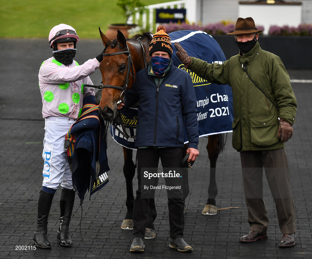 27 April 2021; Jockey Paul Townend, stablehand Vitaliy Stytsko and trainer Willie Mullins celebrate with Chacun Pour Soi after winning the William Hill Champion Steeplechase during day one of the Punchestown Festival at Punchestown Racecourse in Kildare. Photo by David Fitzgerald/Sportsfile