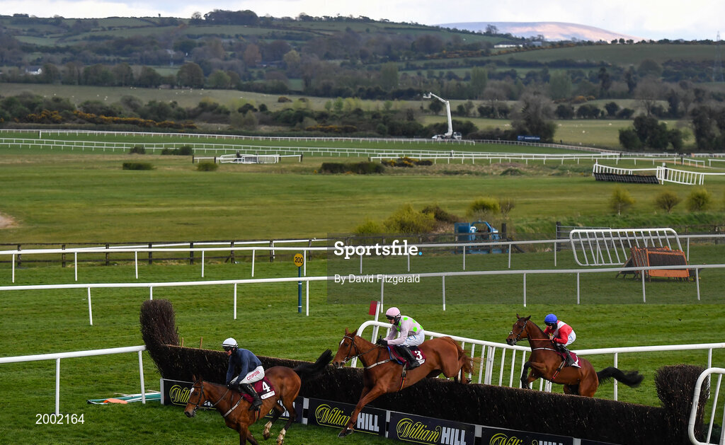 27 April 2021; Runners and riders, from left, Colreevy, with Danny Mullins up, Monkfish, with Paul Townend up, and Envoi Allen, with Rachael Blackmore up, clear the last on their first time round during the Dooley Insurance Group Champion Novice Steeplechase during day one of the Punchestown Festival at Punchestown Racecourse in Kildare. Photo by David Fitzgerald/Sportsfile