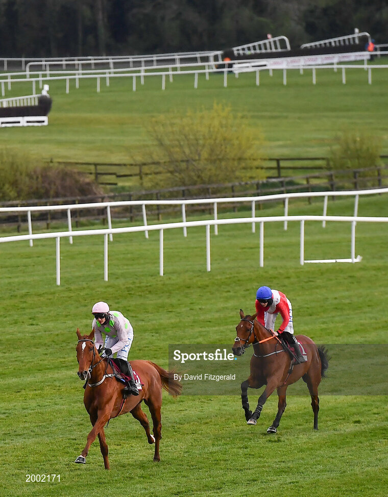 27 April 2021; Monkfish, with Paul Townend up, left, and Envoi Allen, with Rachael Blackmore up, in action during the Dooley Insurance Group Champion Novice Steeplechase during day one of the Punchestown Festival at Punchestown Racecourse in Kildare. Photo by David Fitzgerald/Sportsfile