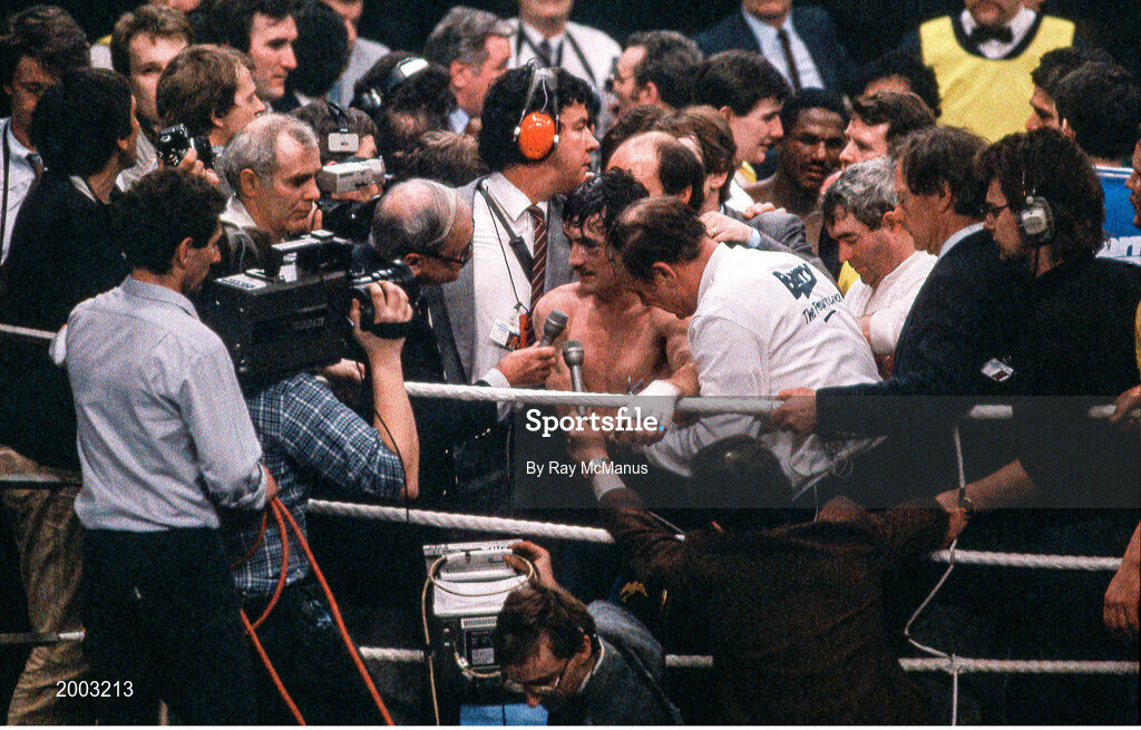 15 February 1986; Barry McGuigan is interviewed by Harry Carpenter of the BBC after defeating Danilo Cabrera during their WBA World Featherweight Title Fight at the RDS in Dublin. Photo by Ray McManus/Sportsfile