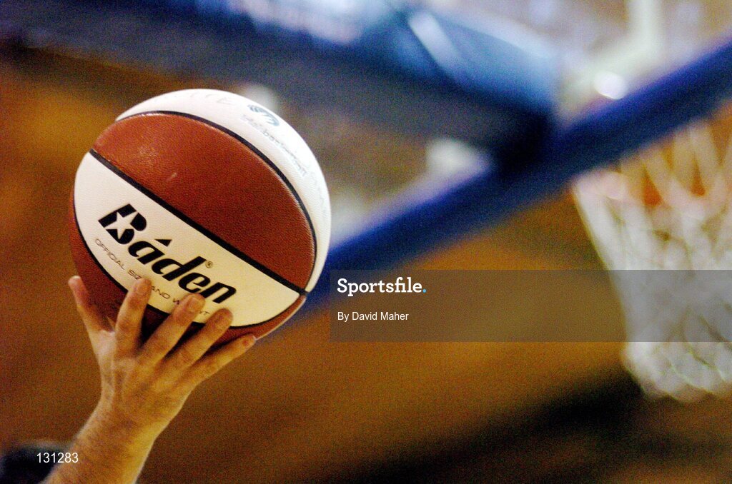 31 January 2004; A referee holds up a basketball. ESB National Cup 2004, Senior Men's Semi-Final, Mardyke UCC Demons v Team Monk, Ballina, The ESB Arena, Tallaght, Dublin. Picture credit; David Maher / SPORTSFILE *EDI*