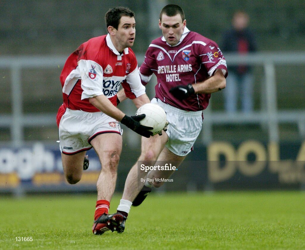 4 January 2004; Peter McGinnity, Louth, in action against Michael Ennis, Westmeath. O'Byrne Cup, Westmeath v Louth, Cusack Park, Mullingar, Co. Westmeath. Picture credit; Ray McManus / SPORTSFILE *EDI*
