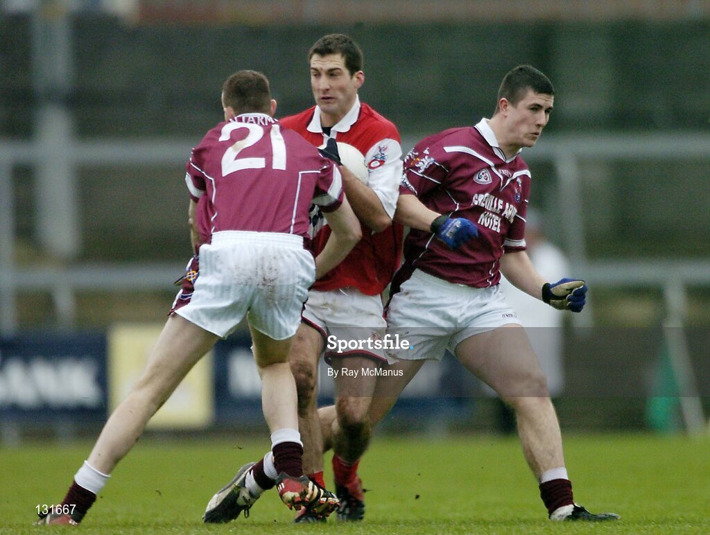 4 January 2004; David Devenney, Louth, in action against Westmeath's Fergal Dardis (21) and Gary Dolan. O'Byrne Cup, Westmeath v Louth, Cusack Park, Mullingar, Co. Westmeath. Picture credit; Ray McManus / SPORTSFILE *EDI*