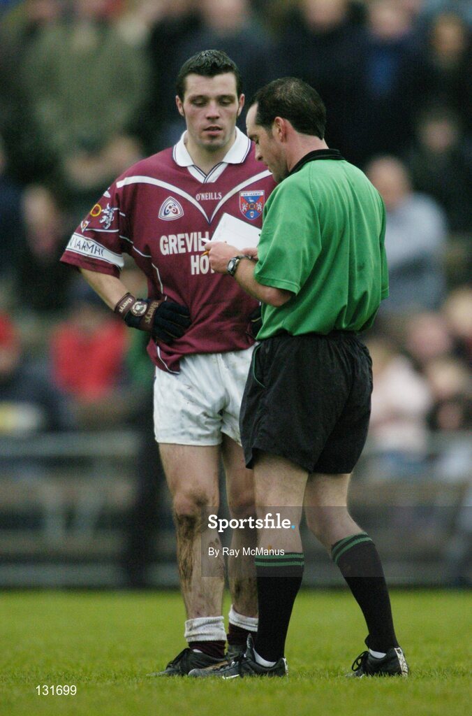 4 January 2004; Referee David Coldrick takes the name of Fergal Murray, Westmeath. O'Byrne Cup, Westmeath v Louth, Cusack Park, Mullingar, Co. Westmeath. Picture credit; Ray McManus / SPORTSFILE *EDI*