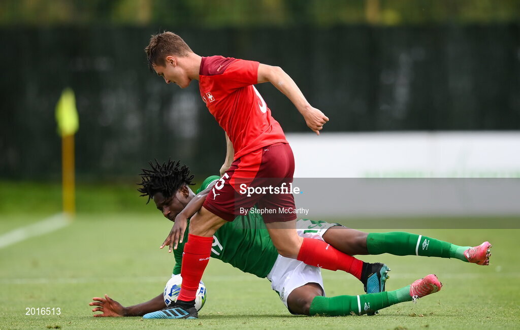 30 May 2021; Joshua Kayode of Republic of Ireland in action against Marco Burch of Switzerland during the U21 international friendly match between Switzerland and Republic of Ireland at Dama de Noche Football Centre in Marbella, Spain. Photo by Stephen McCarthy/Sportsfile