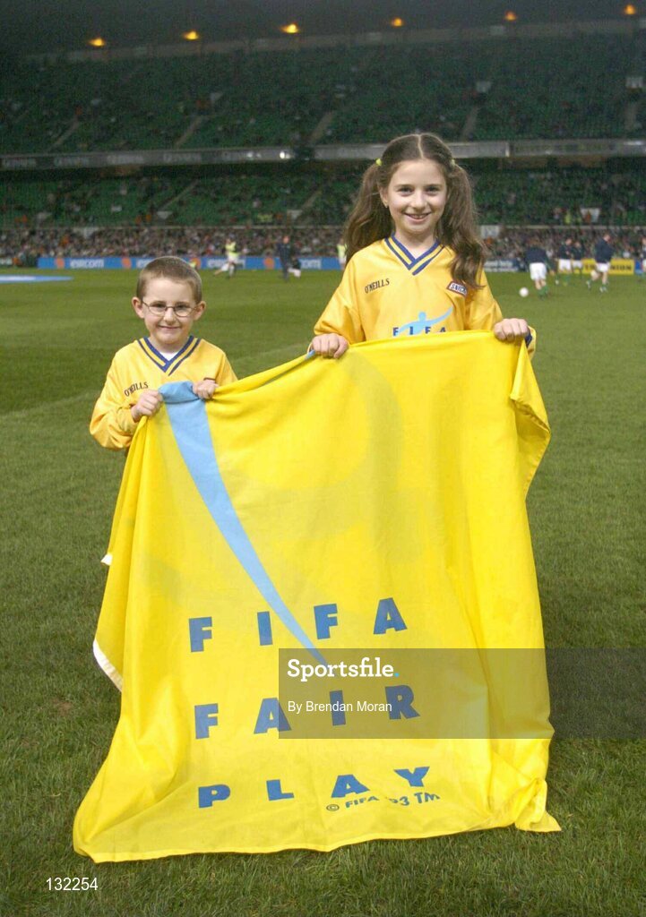 18 February 2004; Darragh Leen, aged 6, left, and Lori McHale, aged 10, from Cork, pictured as members of the Snickers Fair Play team who led the teams out before the game. International Friendly, Republic of Ireland v Brazil, Lansdowne Road. Dublin. Picture credit; Brendan Moran / SPORTSFILE *EDI*