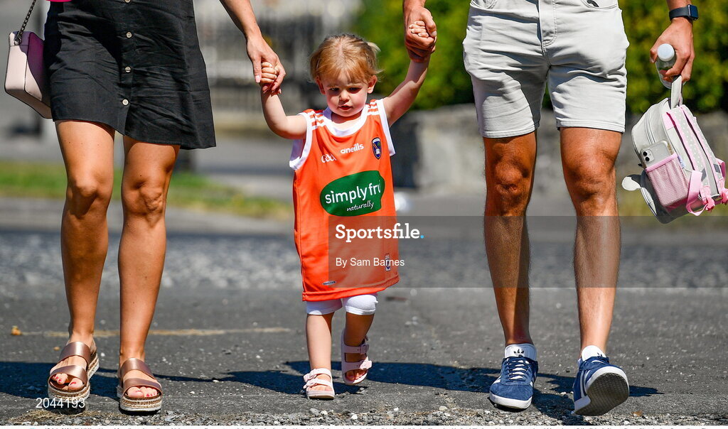 17 July 2021; Heidi Harold, aged 2, walks to the stadium with her parents Former Armagh footballer Stephen Harold, and his wife Laura, before the Ulster GAA Football Senior Championship Semi-Final match between Armagh and Monaghan at Páirc Esler in Newry, Down. Photo by Sam Barnes/Sportsfile