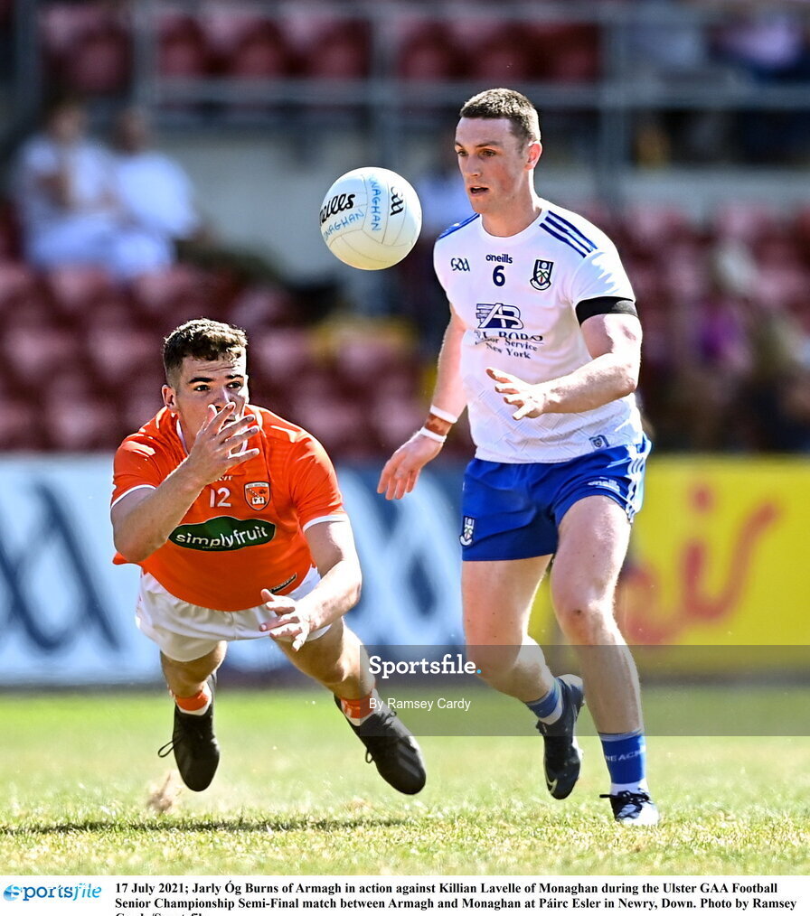 17 July 2021; Jarly Óg Burns of Armagh in action against Killian Lavelle of Monaghan during the Ulster GAA Football Senior Championship Semi-Final match between Armagh and Monaghan at Páirc Esler in Newry, Down. Photo by Ramsey Cardy/Sportsfile