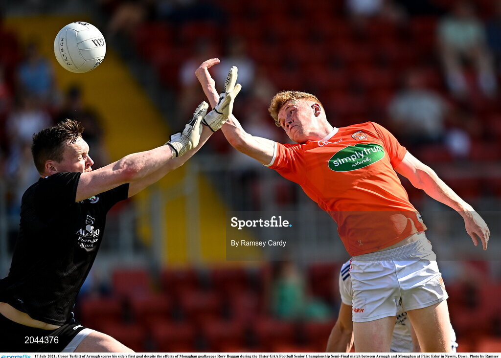 17 July 2021; Conor Turbitt of Armagh scores his side's first goal despite the efforts of Monaghan goalkeeper Rory Beggan during the Ulster GAA Football Senior Championship Semi-Final match between Armagh and Monaghan at Páirc Esler in Newry, Down. Photo by Ramsey Cardy/Sportsfile