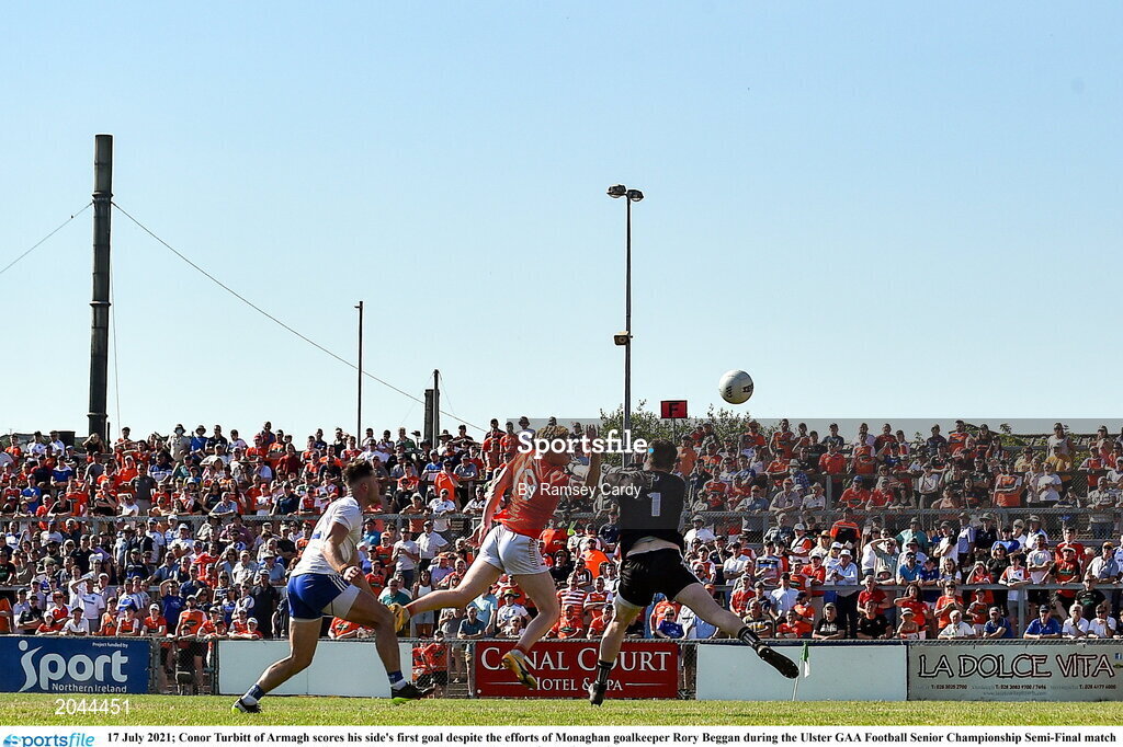 17 July 2021; Conor Turbitt of Armagh scores his side's first goal despite the efforts of Monaghan goalkeeper Rory Beggan during the Ulster GAA Football Senior Championship Semi-Final match between Armagh and Monaghan at Páirc Esler in Newry, Down. Photo by Ramsey Cardy/Sportsfile
