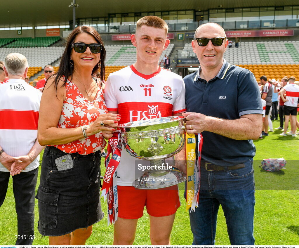 18 July 2021; Derry captain Matthew Downey with his mother Michele and father Henry, former Derry player and 1993 all Ireland winning team captain, after the 2020 Electric Ireland GAA Football All-Ireland Minor Championship Final match between Derry and Kerry at Bord Na Mona O’Connor Park in Tullamore. Photo by Matt Browne/Sportsfile