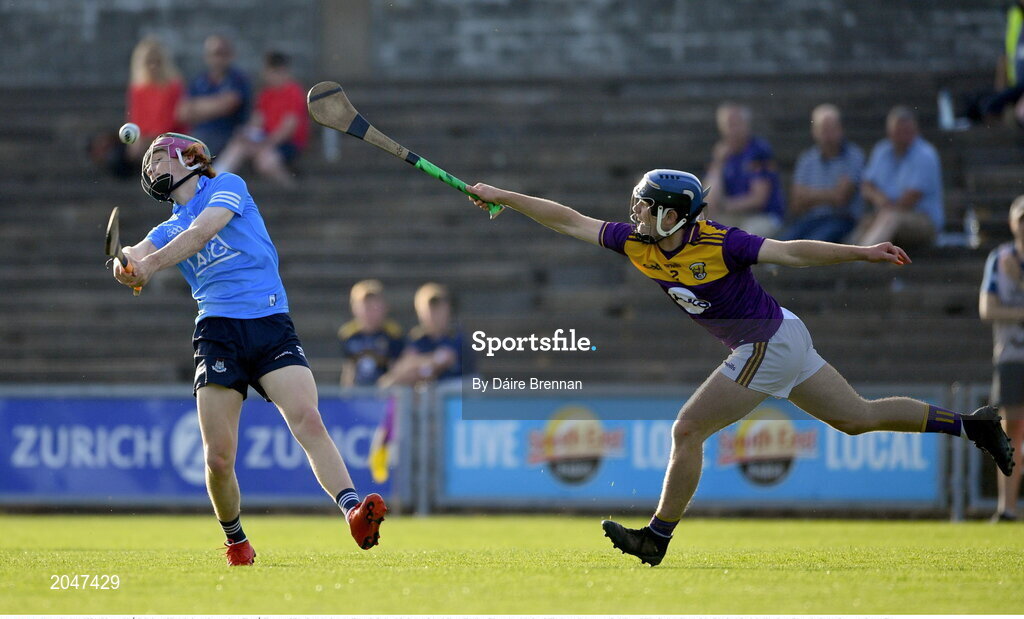 21 July 2021; Diarmuid Ó Dúlaing of Dublin in action against Cian Ó Tuama of Wexford during the Electric Ireland Leinster GAA Minor Hurling Championship Semi-Final match between Dublin and Wexford at Chadwicks Wexford Park in Wexford. Photo by Daire Brennan/Sportsfile