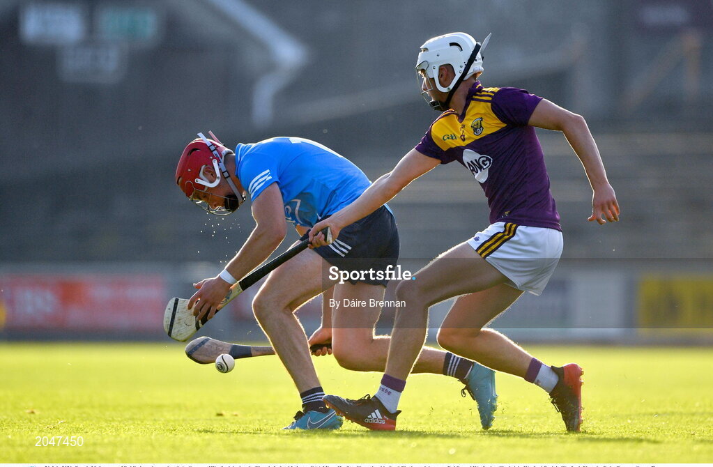 21 July 2021; Dennis McSweeney of Dublin in action against Seán Cooney of Wexford during the Electric Ireland Leinster GAA Minor Hurling Championship Semi-Final match between Dublin and Wexford at Chadwicks Wexford Park in Wexford. Photo by Daire Brennan/Sportsfile