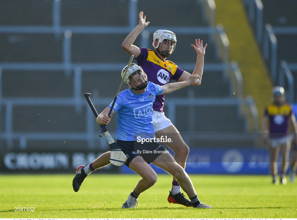 21 July 2021; Conal Ó Riain of Dublin in action against Seán Cooney of Wexford during the Electric Ireland Leinster GAA Minor Hurling Championship Semi-Final match between Dublin and Wexford at Chadwicks Wexford Park in Wexford. Photo by Daire Brennan/Sportsfile