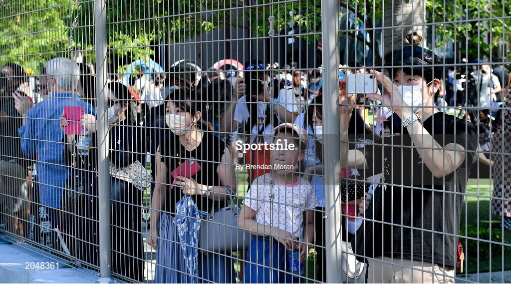 23 July 2021; Local Japanese people attempt to get a glimpse from outside the barriers at the Olympic Stadium before the 2020 Tokyo Summer Olympic Games opening ceremony in Tokyo, Japan. Photo by Brendan Moran/Sportsfile