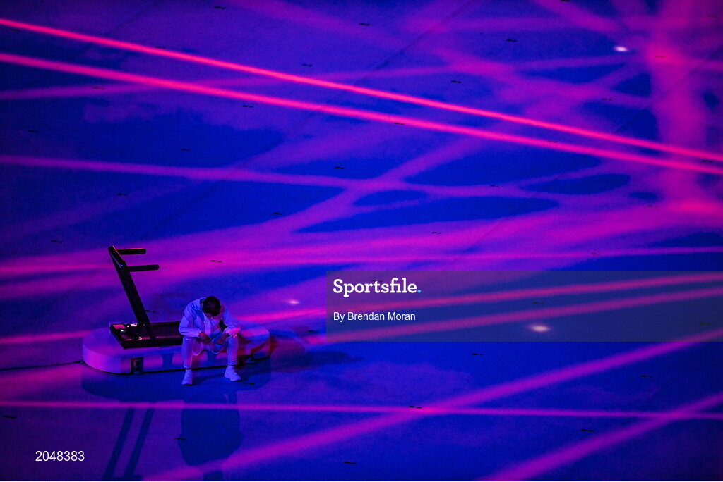 23 July 2021; Performer sits on a treadmill during the light show, of the 2020 Tokyo Summer Olympic Games opening ceremony at the Olympic Stadium in Tokyo, Japan. Photo by Brendan Moran/Sportsfile