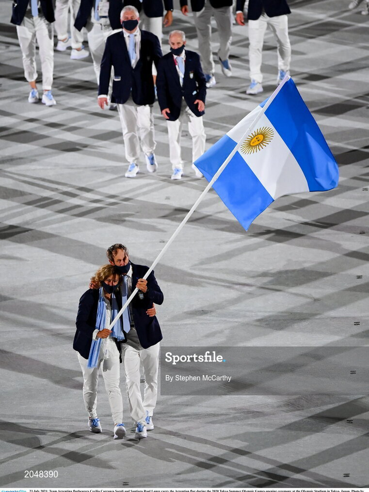 23 July 2021; Team Argentina flagbearers Cecilia Carranza Saroli and Santiago Raul Lange carry the Argentian flag during the 2020 Tokyo Summer Olympic Games opening ceremony at the Olympic Stadium in Tokyo, Japan. Photo by Stephen McCarthy/Sportsfile