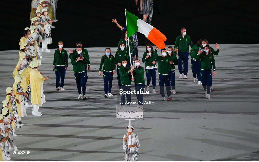 23 July 2021; Team Ireland flagbearers Kellie Harrington, right, and Brendan Irvine carry the Irish tricolour during the 2020 Tokyo Summer Olympic Games opening ceremony at the Olympic Stadium in Tokyo, Japan. Photo by Stephen McCarthy/Sportsfile