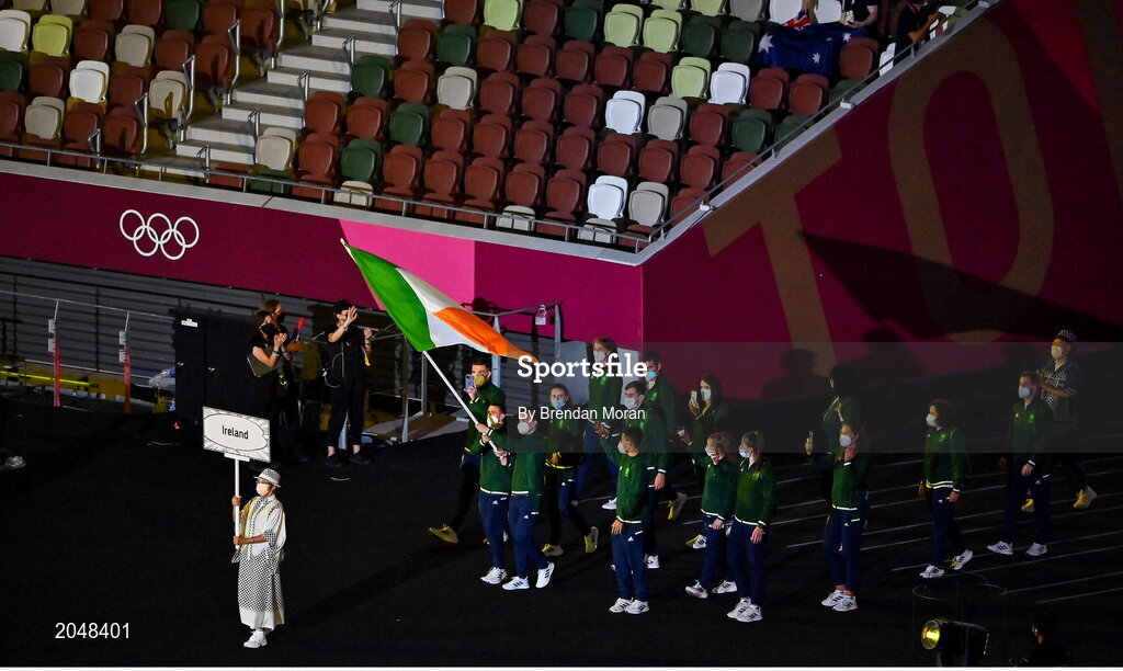 23 July 2021; Team Ireland flagbearers Kellie Harrington and Brendan Irvine carry the Irish tricolour during the 2020 Tokyo Summer Olympic Games opening ceremony at the Olympic Stadium in Tokyo, Japan. Photo by Brendan Moran/Sportsfile