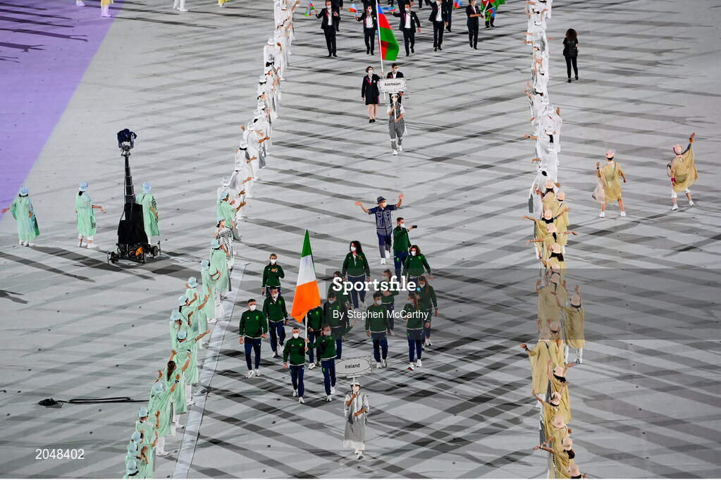 23 July 2021; Team Ireland flagbearers Kellie Harrington, right, and Brendan Irvine carry the Irish tricolour during the 2020 Tokyo Summer Olympic Games opening ceremony at the Olympic Stadium in Tokyo, Japan. Photo by Stephen McCarthy/Sportsfile