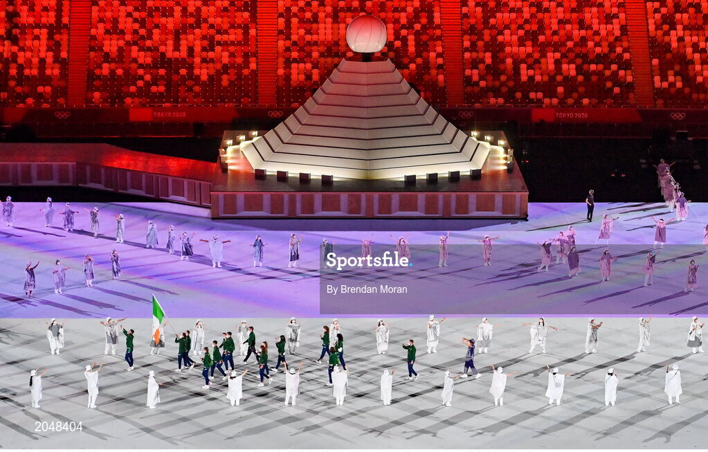 23 July 2021; Team Ireland flagbearers Kellie Harrington and Brendan Irvine carry the Irish tricolour during the 2020 Tokyo Summer Olympic Games opening ceremony at the Olympic Stadium in Tokyo, Japan. Photo by Brendan Moran/Sportsfile