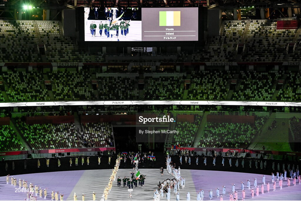 23 July 2021; Team Ireland flagbearers Kellie Harrington, right, and Brendan Irvine carry the Irish tricolour during the 2020 Tokyo Summer Olympic Games opening ceremony at the Olympic Stadium in Tokyo, Japan. Photo by Stephen McCarthy/Sportsfile