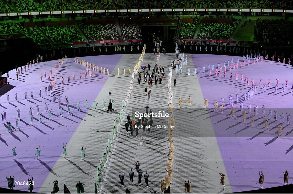 23 July 2021; Team Ireland flagbearers Kellie Harrington, right, and Brendan Irvine carry the Irish tricolour during the 2020 Tokyo Summer Olympic Games opening ceremony at the Olympic Stadium in Tokyo, Japan. Photo by Stephen McCarthy/Sportsfile