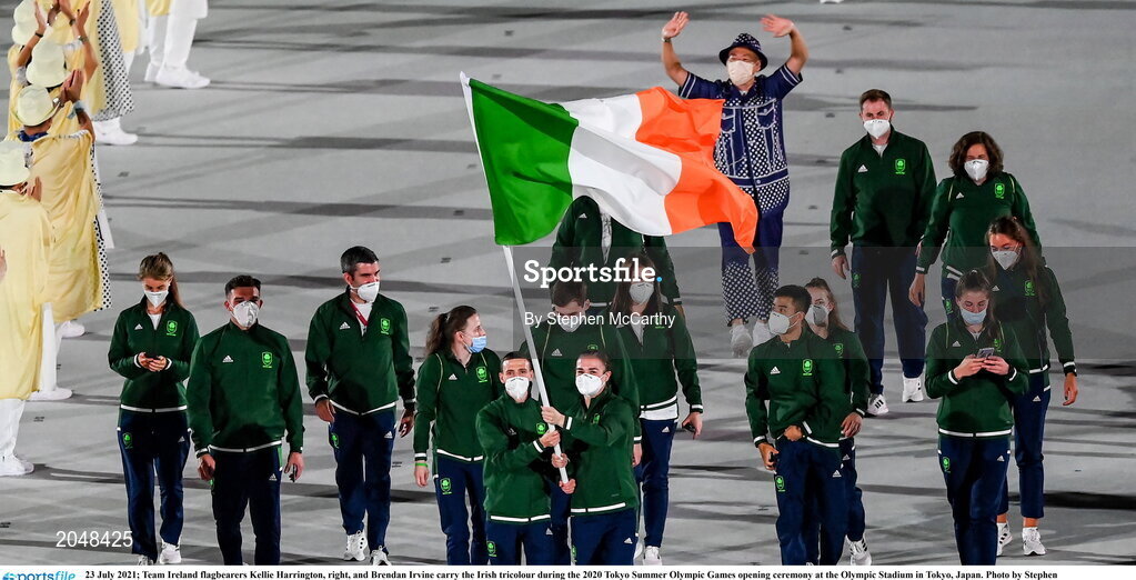 23 July 2021; Team Ireland flagbearers Kellie Harrington, right, and Brendan Irvine carry the Irish tricolour during the 2020 Tokyo Summer Olympic Games opening ceremony at the Olympic Stadium in Tokyo, Japan. Photo by Stephen McCarthy/Sportsfile