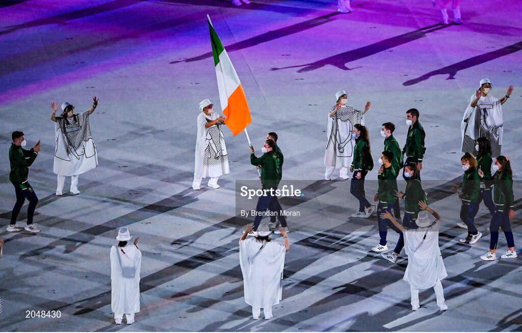 23 July 2021; Light heavyweight Emmet Brennan, left, uses his phone to record proceedings as Team Ireland flagbearers Kellie Harrington and Brendan Irvine carry the Irish tricolour during the 2020 Tokyo Summer Olympic Games opening ceremony at the Olympic Stadium in Tokyo, Japan. Photo by Brendan Moran/Sportsfile