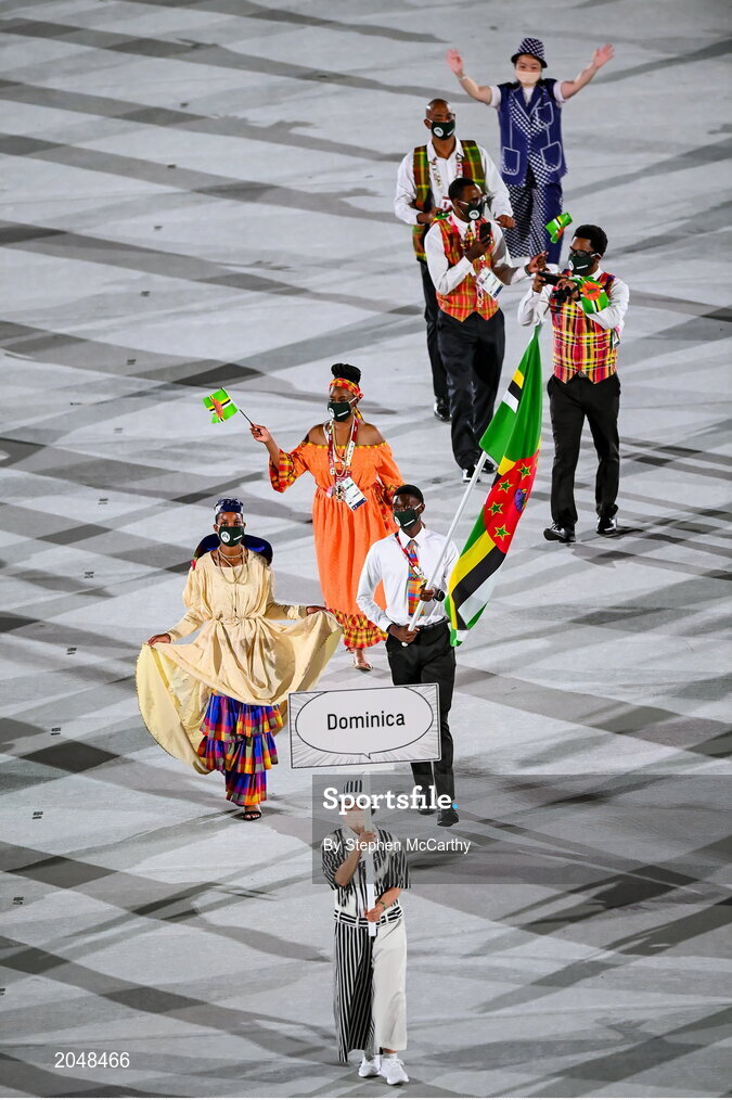 23 July 2021; Team Dominica flagbearers Thea Lafond and Dennick Luke carry the Dominica flag during the 2020 Tokyo Summer Olympic Games opening ceremony at the Olympic Stadium in Tokyo, Japan. Photo by Stephen McCarthy/Sportsfile