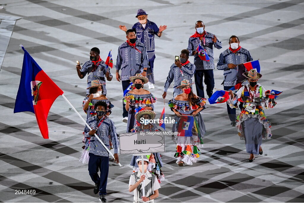 23 July 2021; Team Haiti flagbearers Sabiana Anestor and Darrelle Valsaint Jr carry the Haitian flag during the 2020 Tokyo Summer Olympic Games opening ceremony at the Olympic Stadium in Tokyo, Japan. Photo by Stephen McCarthy/Sportsfile