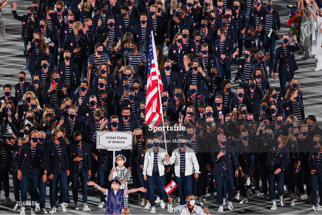 23 July 2021; Team USA flagbearers Sue Bird and Eddy Alvares carry the USA flag during the 2020 Tokyo Summer Olympic Games opening ceremony at the Olympic Stadium in Tokyo, Japan. Photo by Stephen McCarthy/Sportsfile