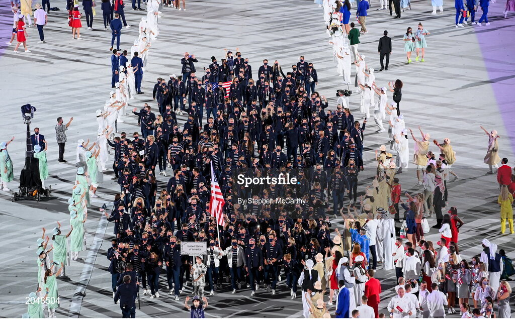 23 July 2021; Team USA flagbearers Sue Bird and Eddy Alvares carry the USA flag during the 2020 Tokyo Summer Olympic Games opening ceremony at the Olympic Stadium in Tokyo, Japan. Photo by Stephen McCarthy/Sportsfile