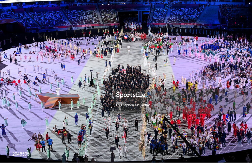 23 July 2021; Team USA flagbearers Sue Bird and Eddy Alvares carry the USA flag during the 2020 Tokyo Summer Olympic Games opening ceremony at the Olympic Stadium in Tokyo, Japan. Photo by Stephen McCarthy/Sportsfile