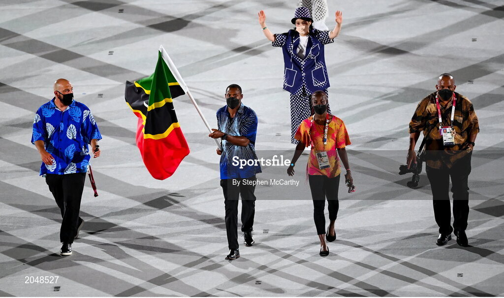 23 July 2021; Team Saint Kitts and Nevis flagbearers Amya Clarke and Jason Rogers carry the Saint Kitts and Nevis flag during the 2020 Tokyo Summer Olympic Games opening ceremony at the Olympic Stadium in Tokyo, Japan. Photo by Stephen McCarthy/Sportsfile