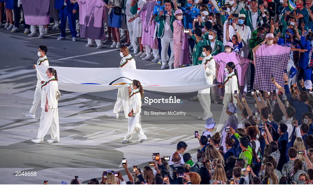 23 July 2021; Representatives of the six federations bring the olympic flag into the stadium during the 2020 Tokyo Summer Olympic Games opening ceremony at the Olympic Stadium in Tokyo, Japan. Photo by Stephen McCarthy/Sportsfile
