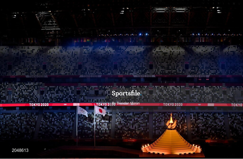 23 July 2021; The Olympic flame is lit as empty seats are seen during the 2020 Tokyo Summer Olympic Games opening ceremony at the Olympic Stadium in Tokyo, Japan. Photo by Brendan Moran/Sportsfile