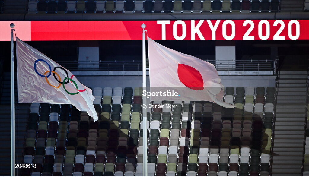 23 July 2021; The Olympic and Japanese flags fly together in front of empty seats during the 2020 Tokyo Summer Olympic Games opening ceremony at the Olympic Stadium in Tokyo, Japan. Photo by Brendan Moran/Sportsfile