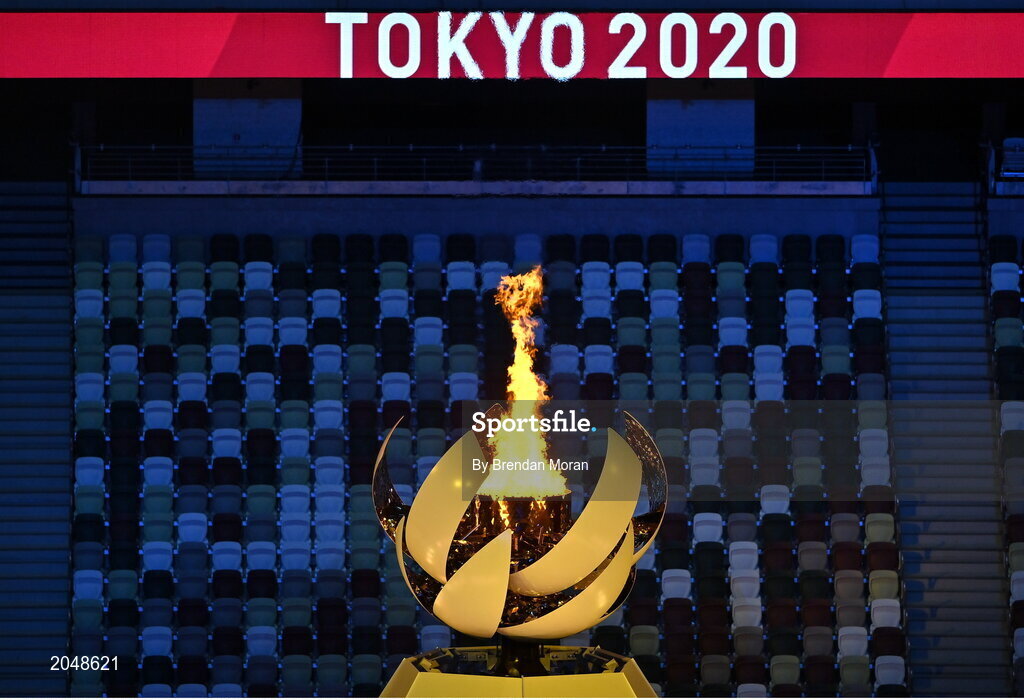 23 July 2021; The Olympic flame burns in front of empty seats during the 2020 Tokyo Summer Olympic Games opening ceremony at the Olympic Stadium in Tokyo, Japan. Photo by Brendan Moran/Sportsfile