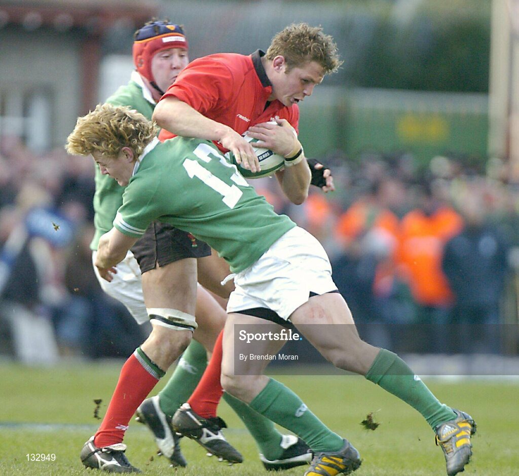 22 February 2004; Dafydd Jones, Wales, in action against Ireland's Brian O'Driscoll (13) and Anthony Foley. RBS 6 Nations Championship 2003-2004, Ireland v Wales, Lansdowne Road, Dublin. Picture credit; Brendan Moran / SPORTSFILE *EDI*