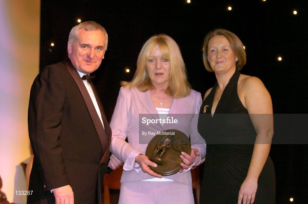 28 February 2004; Marian Carolan, on behalf of the late Kathleen Mills Hill, Dublin, who was named on the Camogie team of the Century, with An Taoiseach, Bertie Ahern, TD, and Miriam O'Callaghan, Uachtaran, Cumann Camogaiochta na nGael, at the Cumann Camogaiochta na nGael centenary celebrations at the Citywest Hotel, Dublin. Picture credit; Ray McManus / SPORTSFILE *EDI*